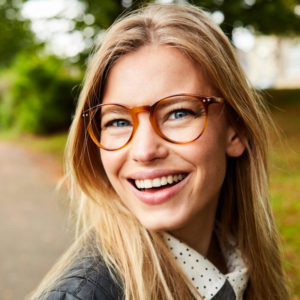woman in glasses smiling